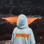 Future Purpose, person wearing hoodie facing body of water