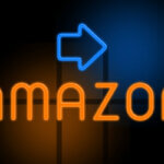 Amazon - orange glowing text with an arrow on dark background